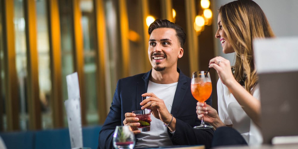 Couple enjoying cocktails at Apex City of Bath Hotel
