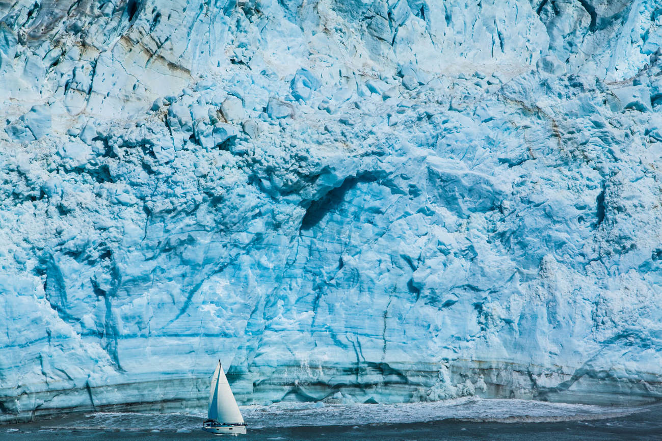 Among the Polar Ice explores life in the Arctic Wall of snow and ice at the Arctic with boat