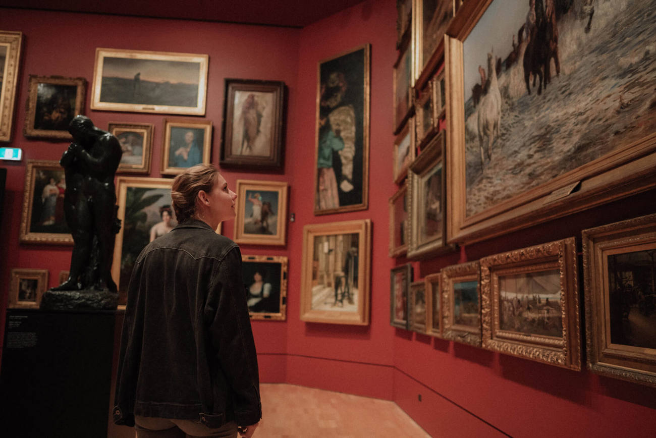 Edinburgh's fascinating galleries and museums Woman looking at painting in art gallery