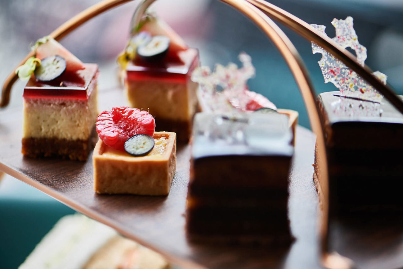 Top tier of afternoon tea stand with cakes