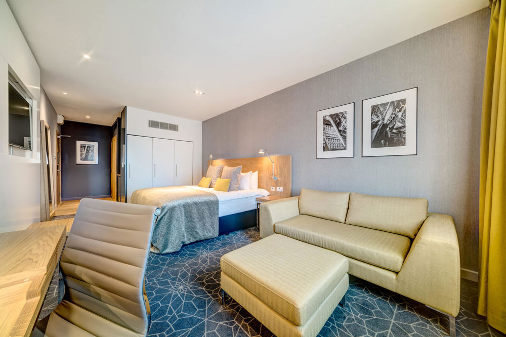 Superior Room at Apex City of Glasgow Hotel Superior Room with sofa, desk and TV