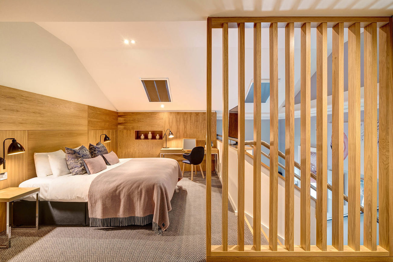 Upstairs bedroom area in Duplex Suite