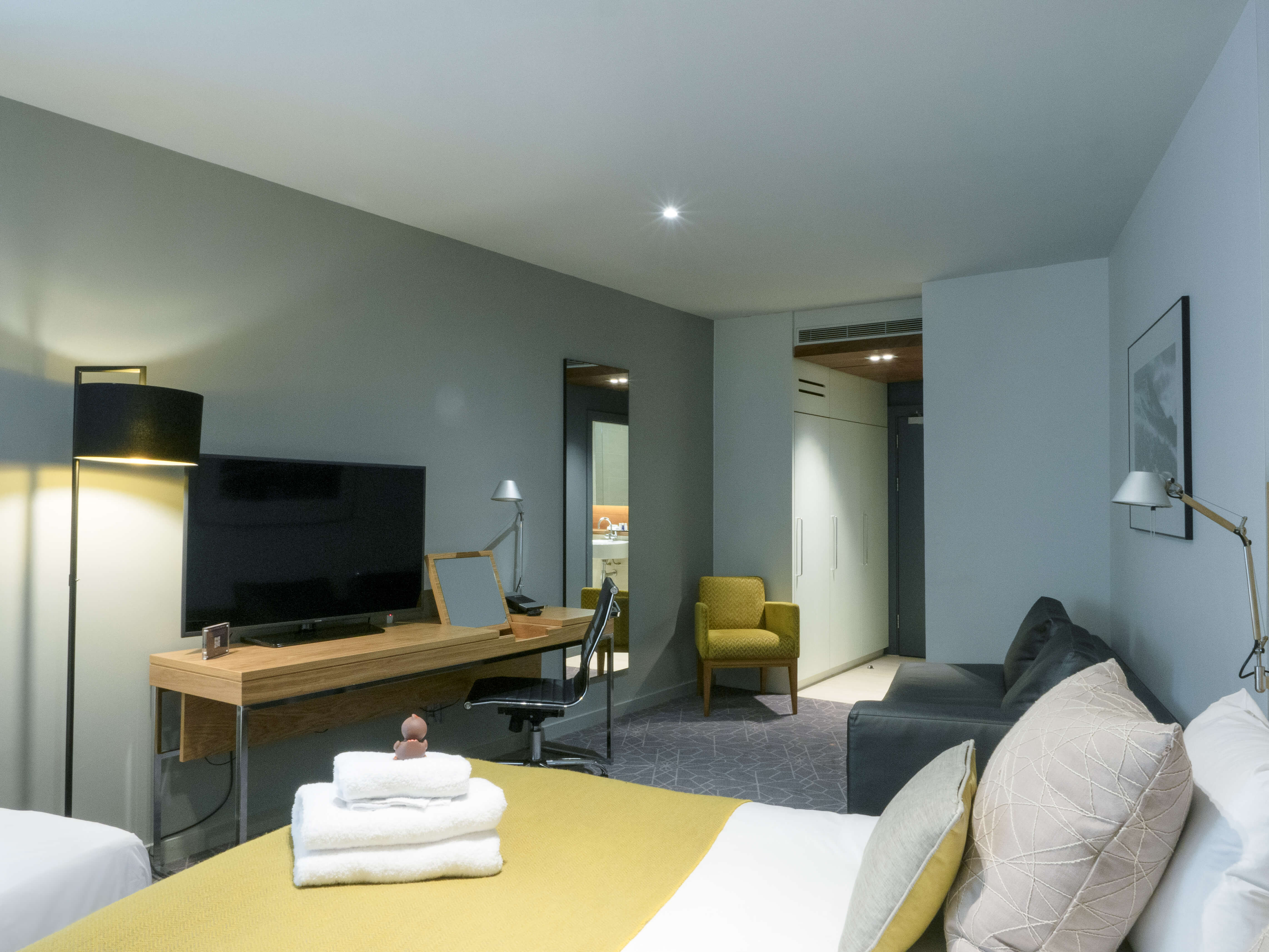 Family Room bed and tv at Apex Waterloo Place Hotel