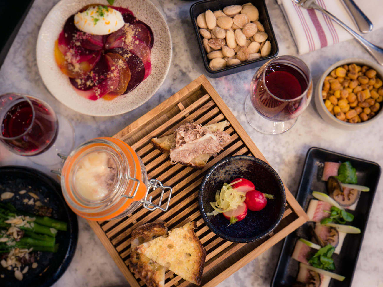 Eat and sip at Lazy Ballerinas Flatlay of small plates and wine at Lazy Ballerinas wine bar