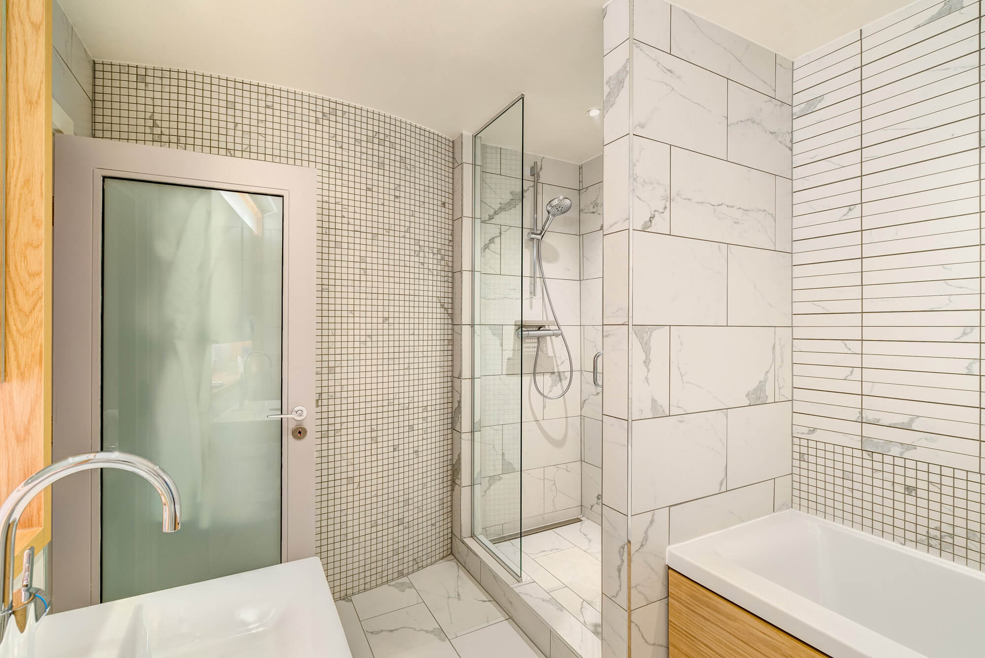 Bathroom and upstairs bedroom area in Duplex Suite at Apex Waterloo Place Hotel