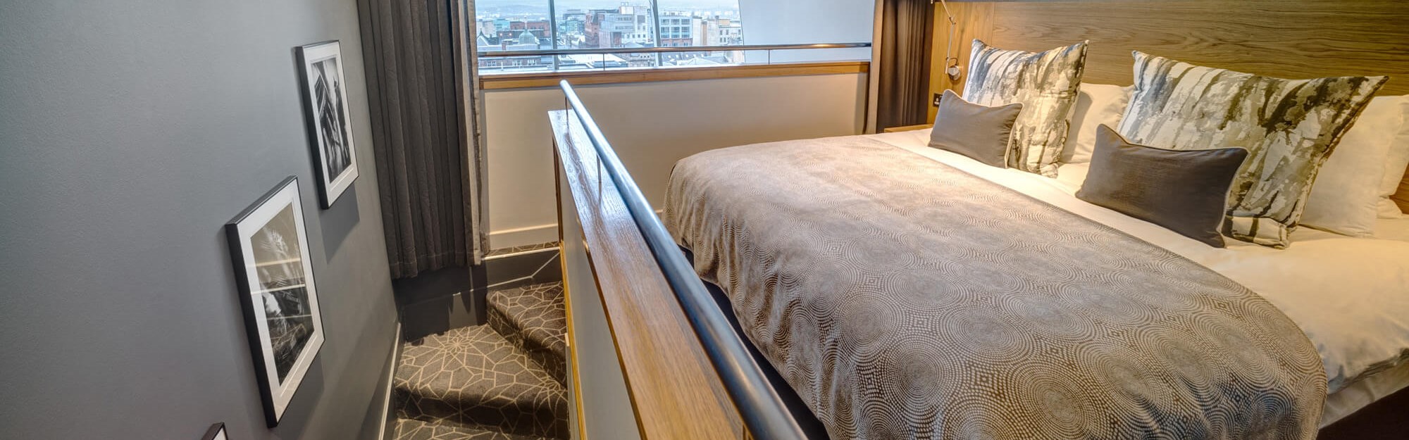 Duplex Suite bedroom upstairs with double bed at Apex City of Glasgow Hotel