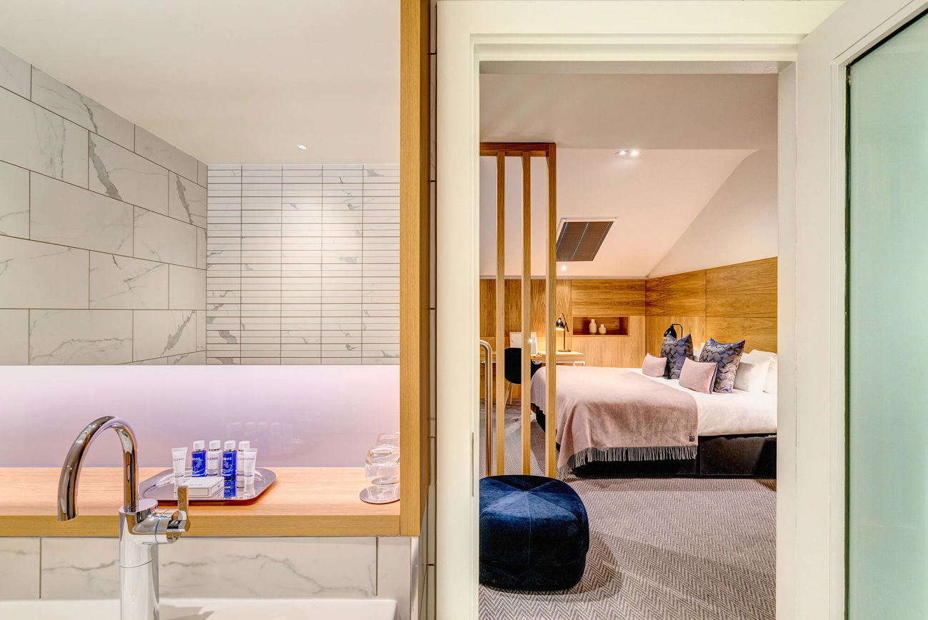 Upstairs with marble bathroom and bedroom in Duplex Suite at Apex Waterloo Place Hotel