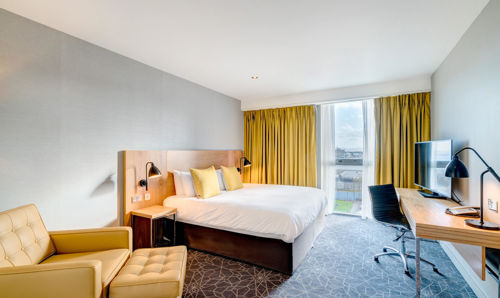 City Room at Apex City Quay Hotel & Spa Apex City Quay Hotel City Bedroom with double bed, large desk and arm chair
