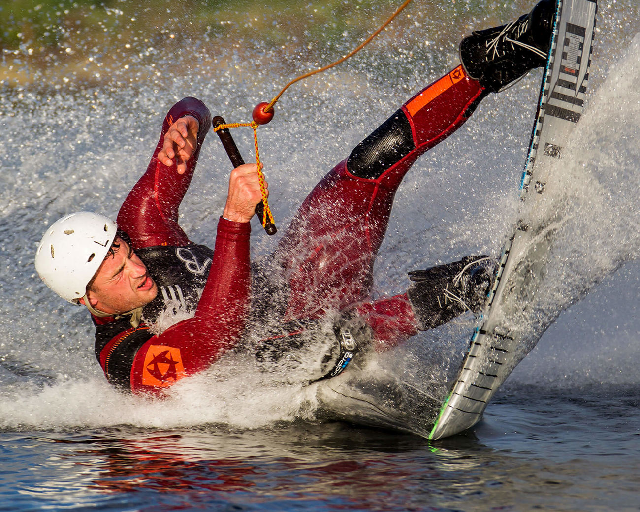 Male water skiing wearing wetsuit