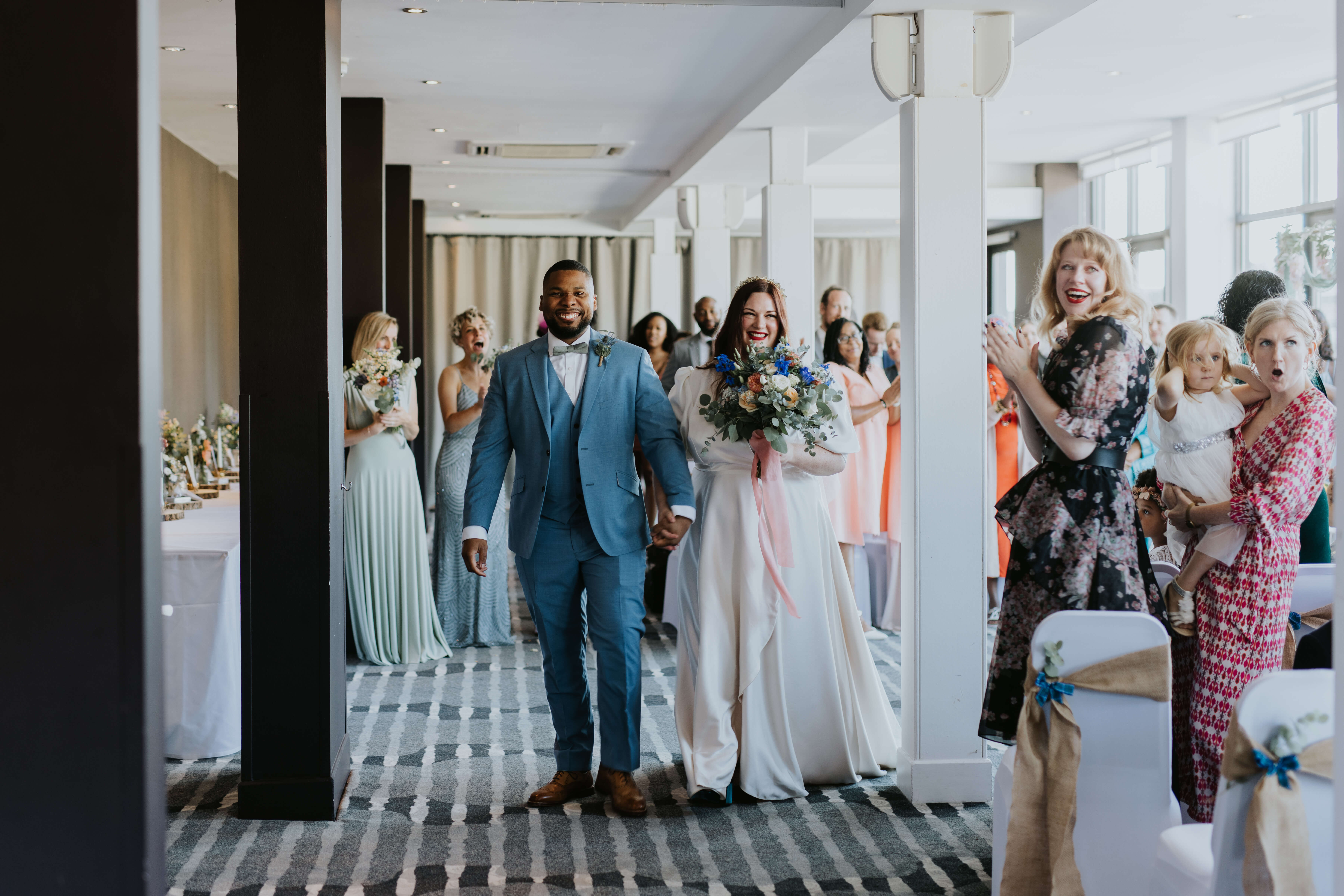 Couple Walking Down Aisle