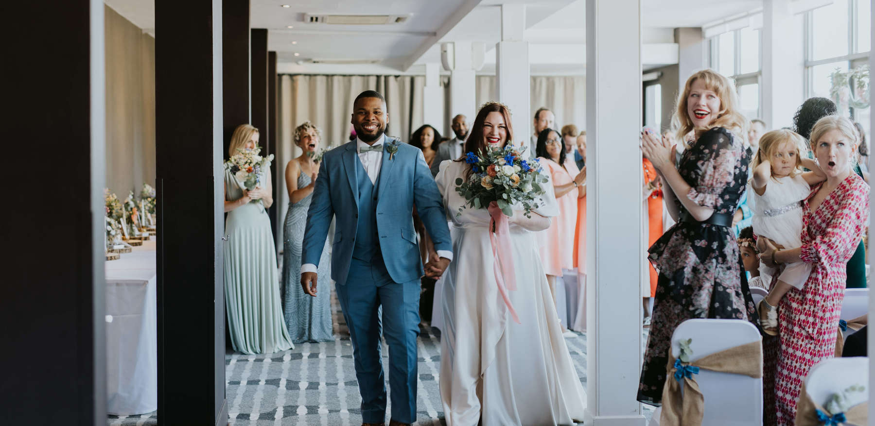 Couple Walking Down Aisle