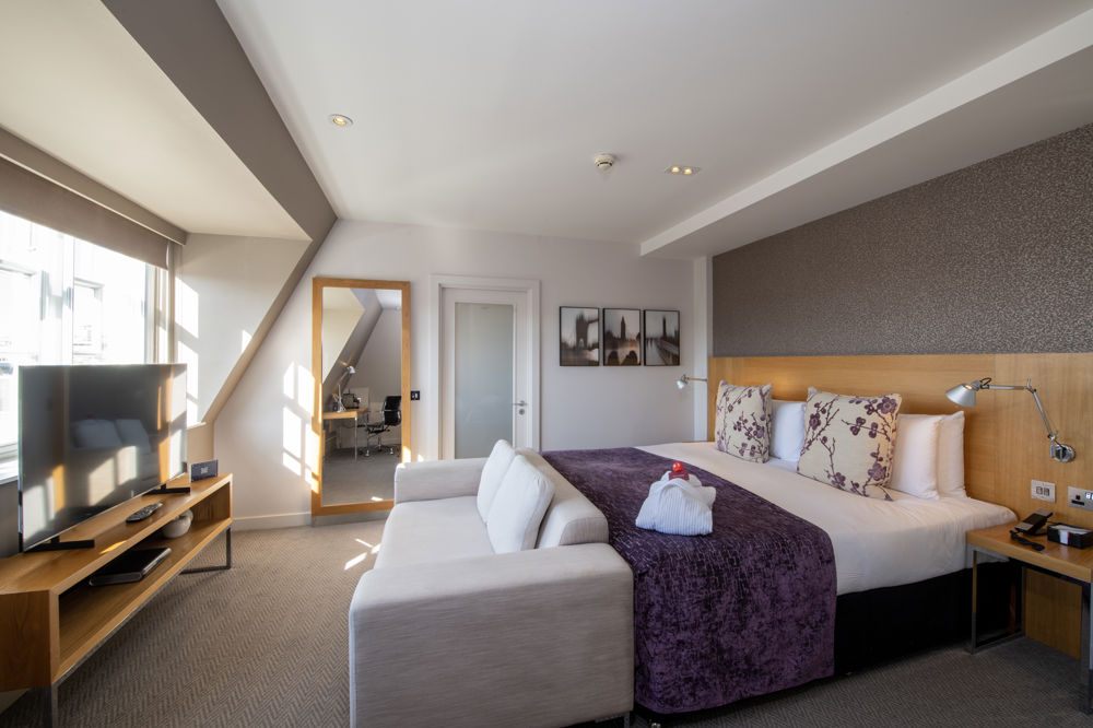 Deluxe Room at Apex Temple Court Hotel Deluxe Room with super king-size bed, desk and floor-to-ceiling windows at Apex Temple Court Hotel