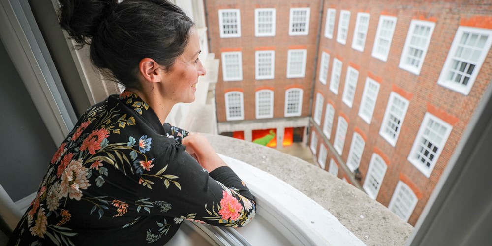 Blogger Christina The Daydreamer gazing out of window at Apex Temple Court Hotel