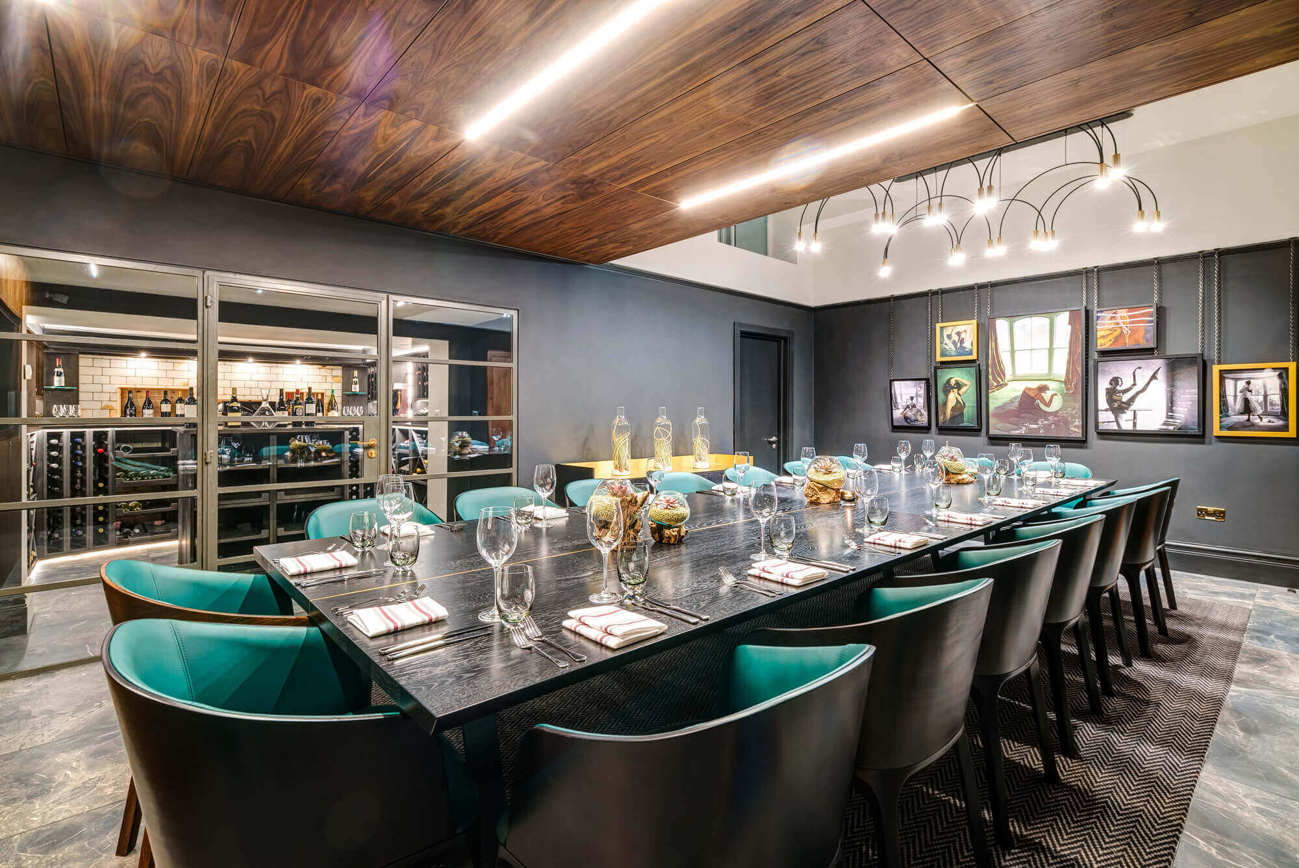 The Liberality Room at Lazy Ballerinas The Liberality Room with wine cellar and table set boardroom style for private dining at Lazy Ballerinas