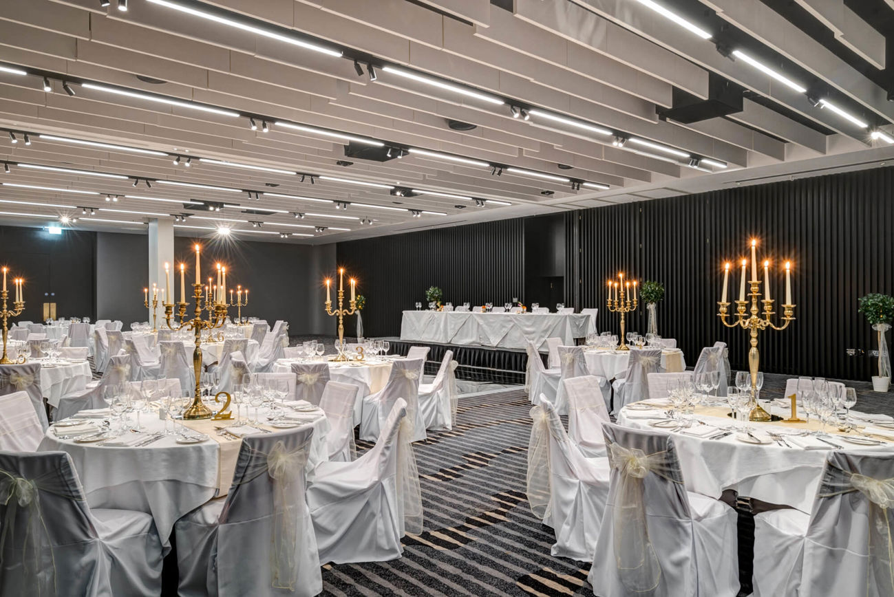 The Lansdown Suite set for wedding with white tablecloths and gold candles
