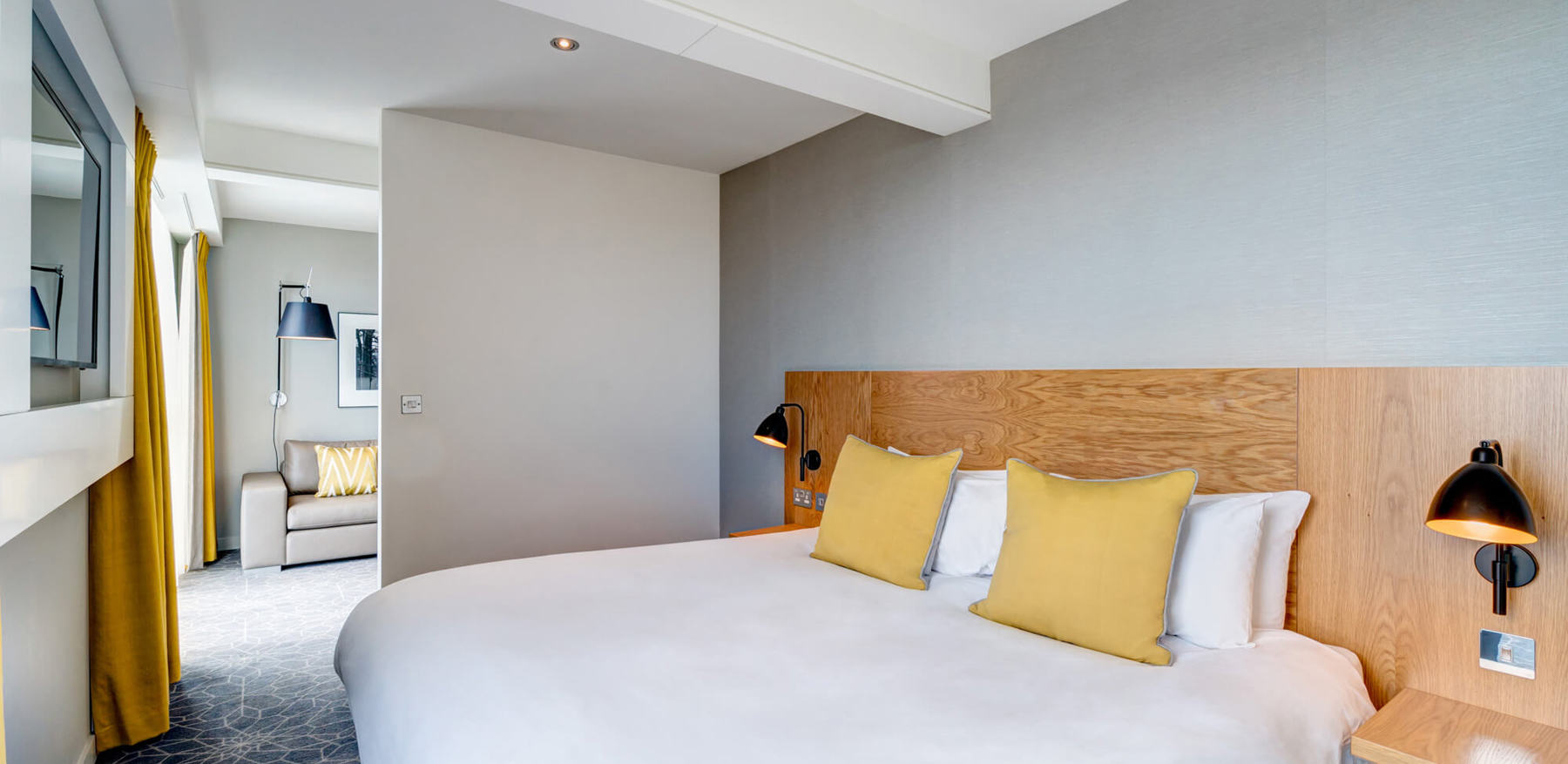 Junior Suite at Apex City Quay Hotel & Spa Junior Suite bedroom with king-size bed and TV