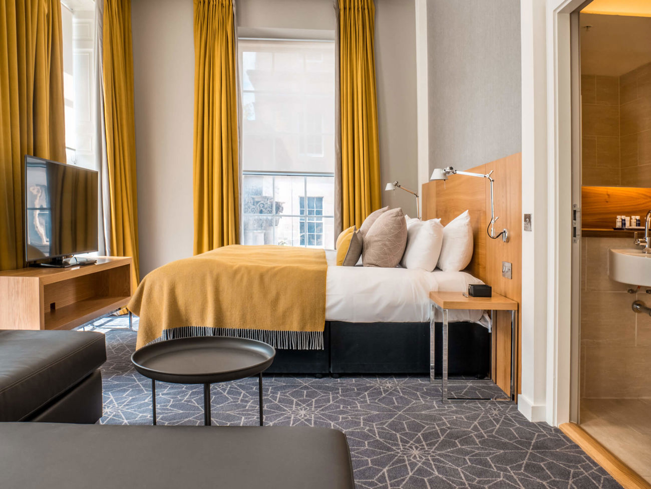 Family Room with king-size bed and sofa bed at Apex Waterloo Place Hotel