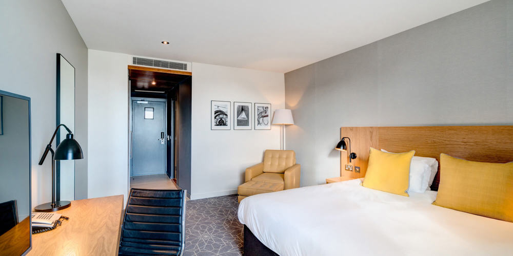 King-size bed with desk and TV