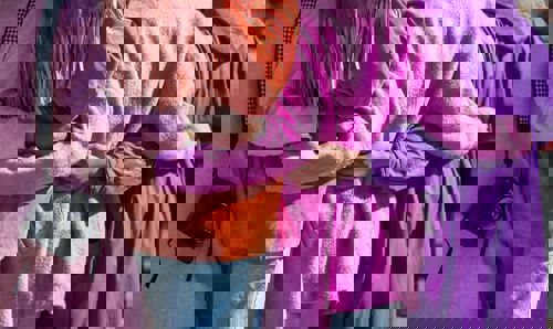 women with arms wrapped around each other women with arms wrapped around each other