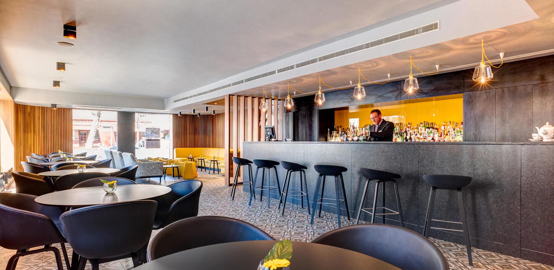 Agua Bar with tables at Apex City of Edinburgh Hotel hotel in edinburgh old town