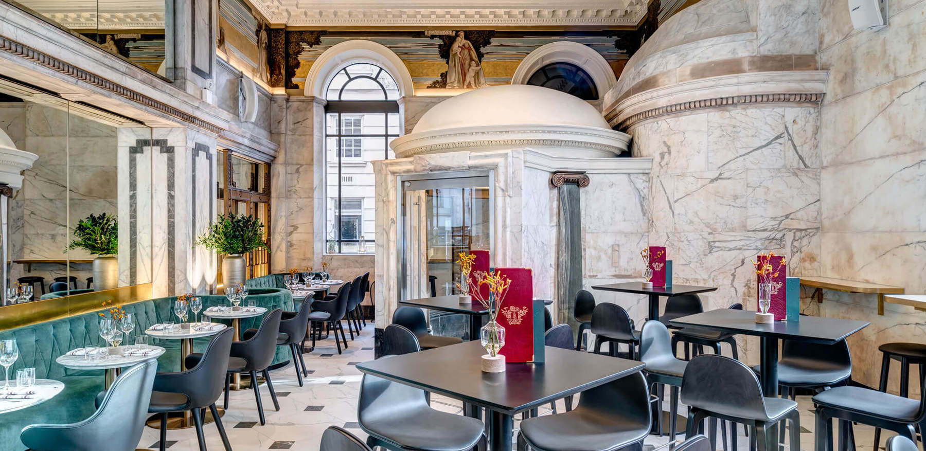 Empty Restaurant With Tables, Blue Velvet Seating & Marble Interior Empty Restaurant With Tables, Blue Velvet Seating & Marble Interior