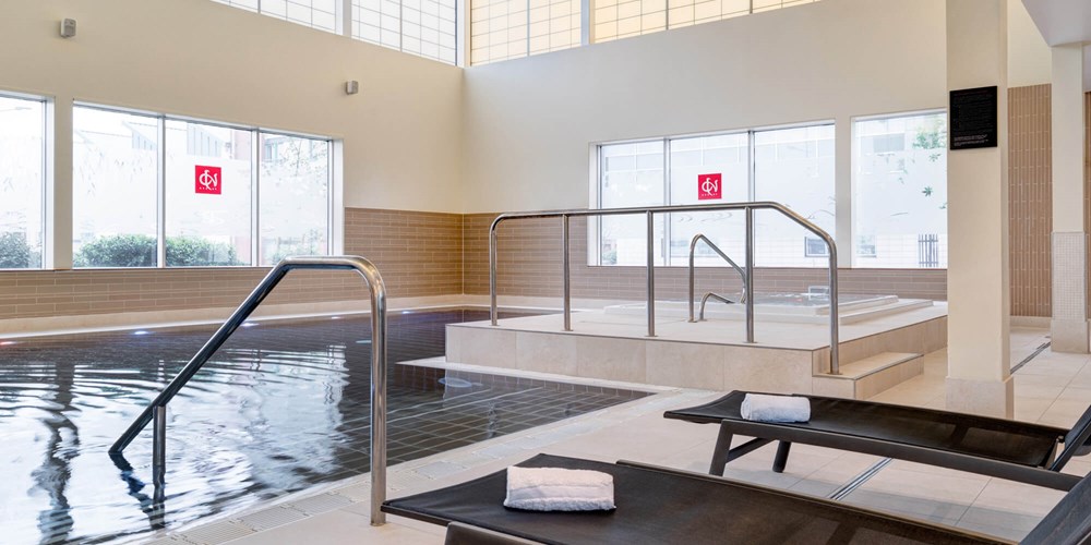 Yu Spa swimming pool with poolside loungers