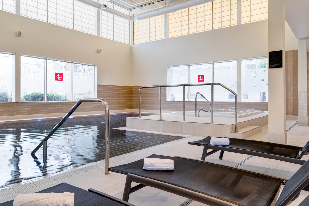 Swimming pool with poolside loungers at Yu Spa, Dundee